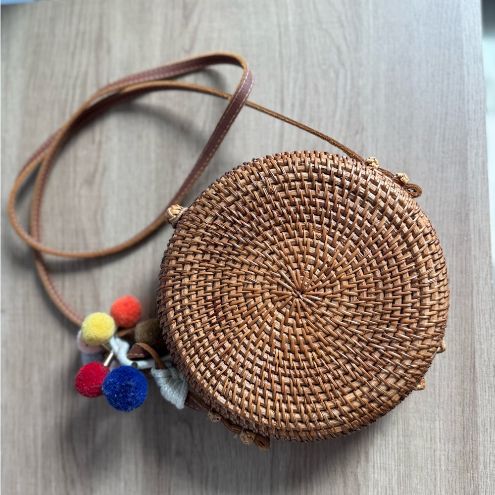 Round Woven Tan Bag with Colorful Pom Poms